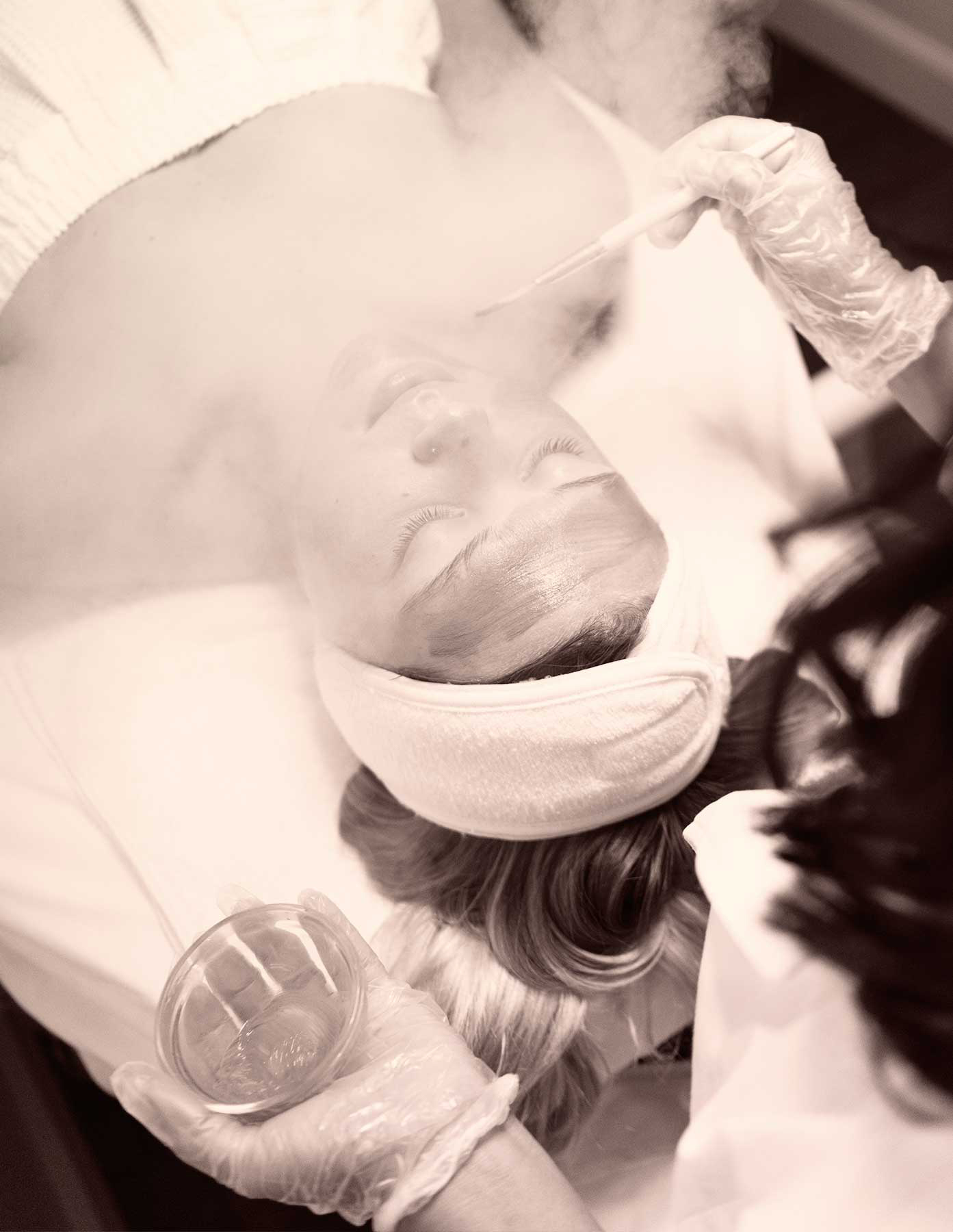 Esthetician doing a facial